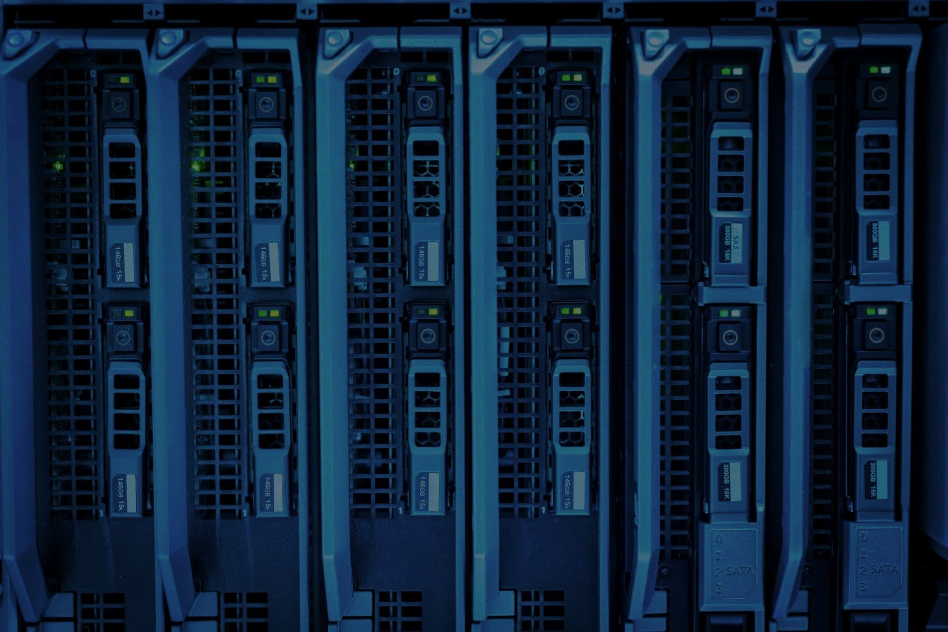 Blade servers in a rack lit with cool blue light