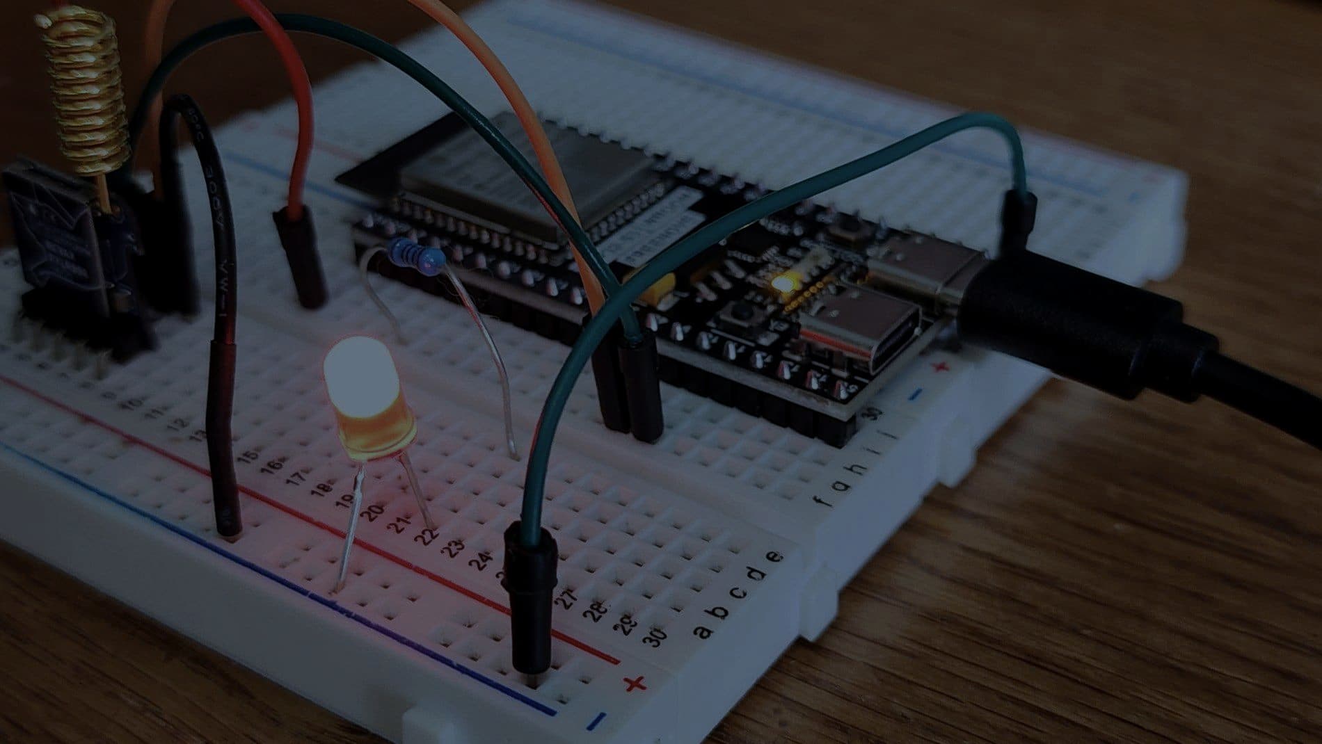 A microcontroller board wired into a prototyping breadboard