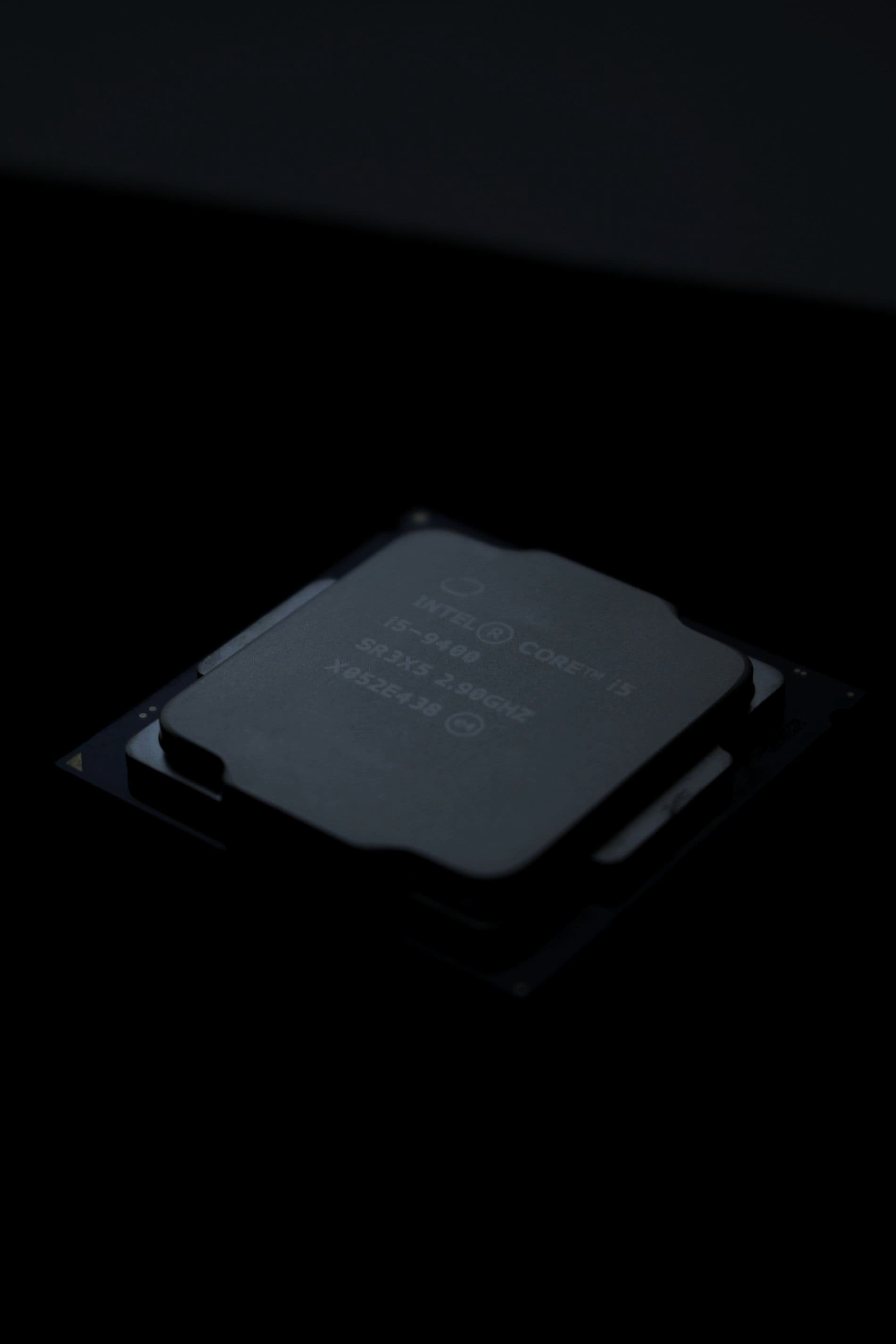 A computer processor chip on a black surface