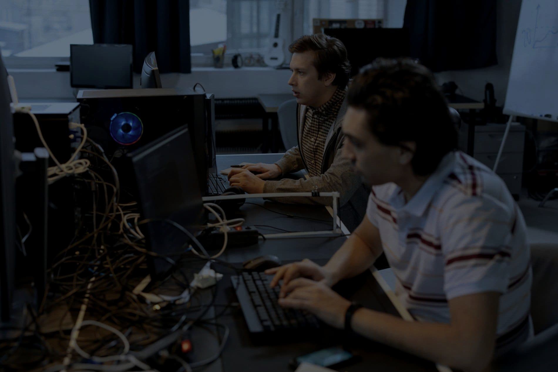 People working at computers in a technical lab
